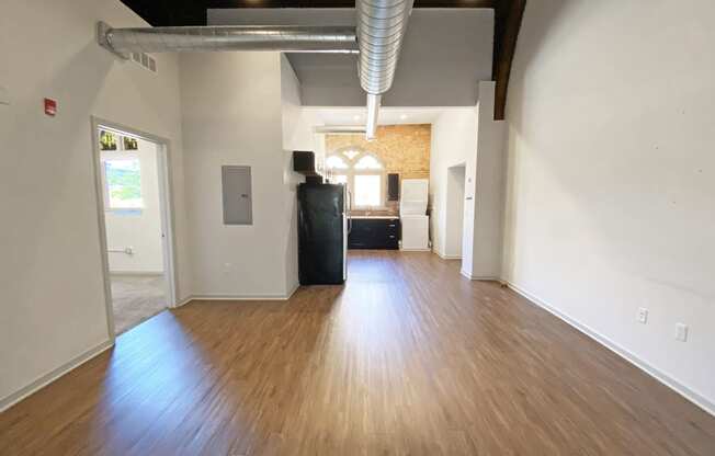Hardwood Flooring in Kitchen Space at University Commons, Oakland 15213 McKee Place Apartments