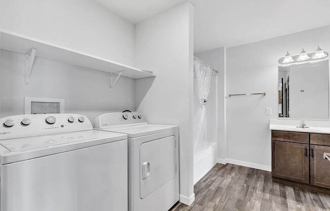 A laundry room with a washer and dryer.