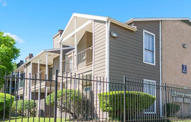 the outside of a residential building at Kirkwood Landing Apartments in Houston, TX 77099