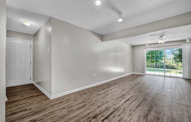 Spacious Living Area With Wood-Style Flooring