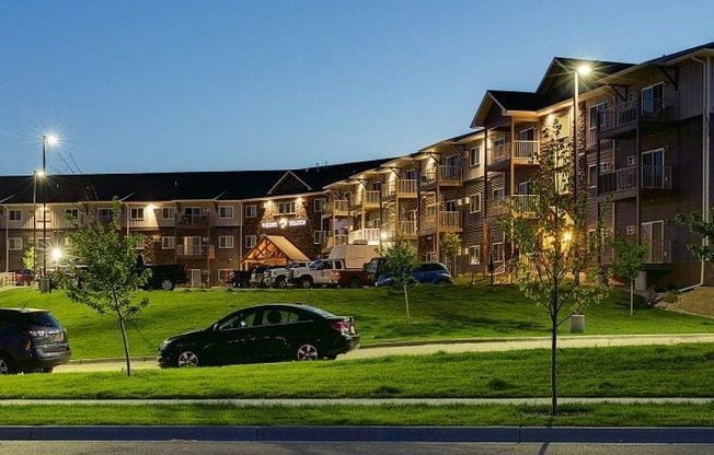 Night Exterior View of Bluffs of Williston Apartments ND