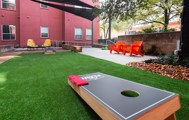 a backyard with a ping pong table and grass