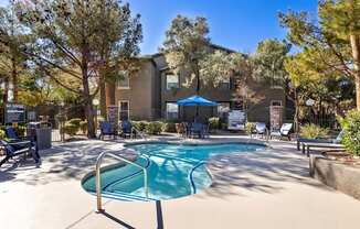 A pool surrounded by trees and chairs with a sign that says "NO RVING".