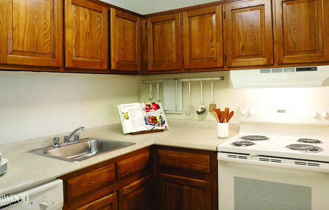 Fully Equipped Kitchen Includes Frost-Free Refrigerator, Electric Range, & Dishwasher at Southwood Luxury Apartments, New York