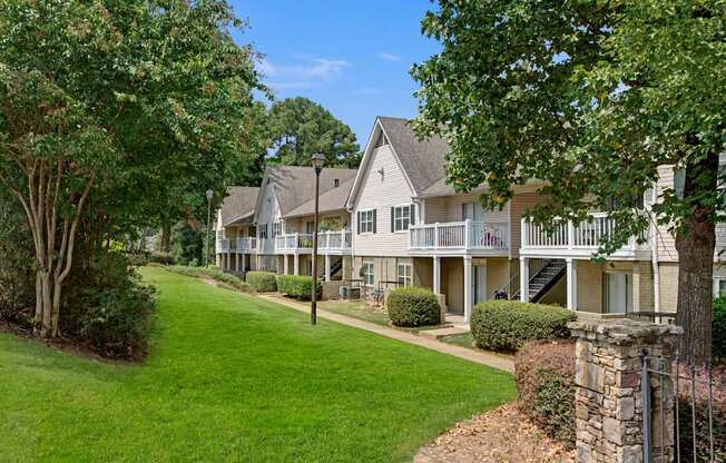 A row of houses with green lawns at Dunwoody Glen, Atlanta, GA