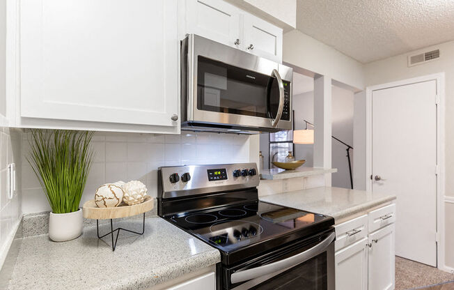 Kitchen with Stainless Steel Microwave and Oven
