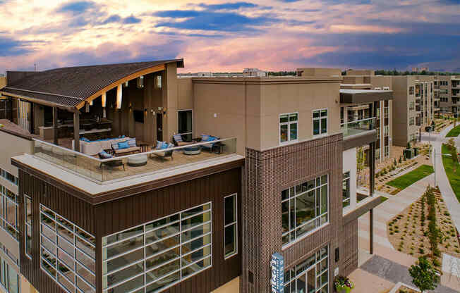 Outdoor rooftop lounge with plush furniture at Encore at Boulevard One, Denver, 80230