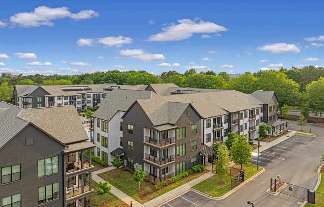 an aerial view of an apartment building on a city street