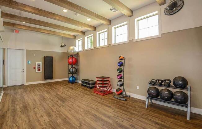 a room with a bunch of weights and mirrors in it  at Palm Bay Club, Jacksonville, Florida