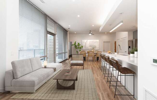 A modern living room with a grey sofa and a coffee table.