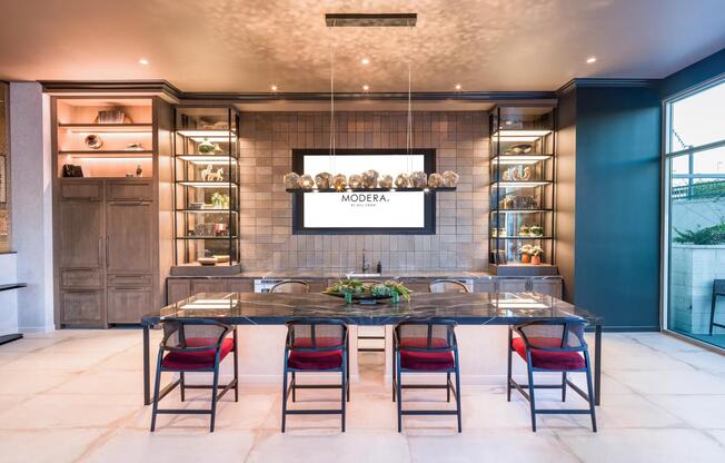 Enjoy an expansive rooftop clubroom with a demonstration kitchen and gathering spaces opening to the rooftop deck.