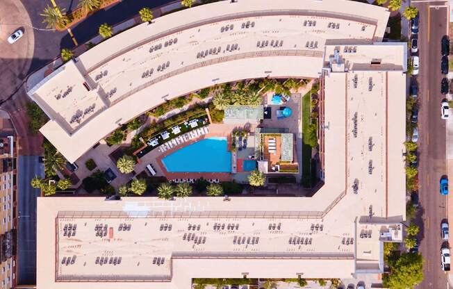 A large building with a pool in the middle of it.