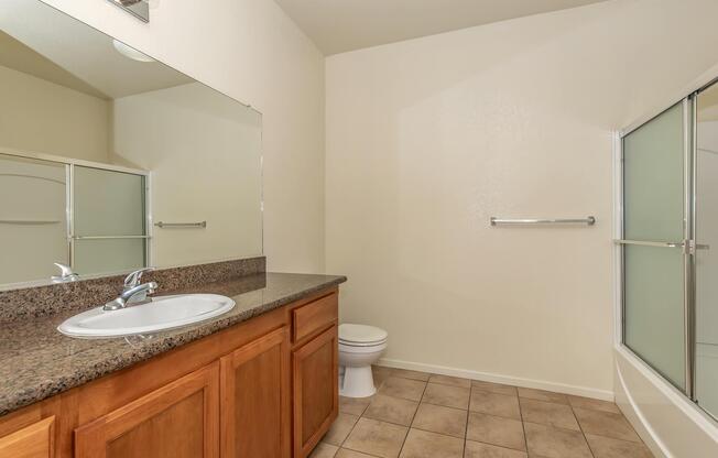 a kitchen with a sink and a mirror