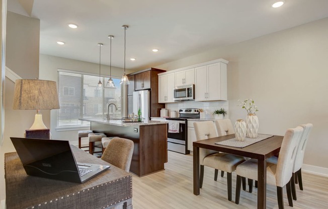 a kitchen and dining room with a laptop on a table in southfield MI