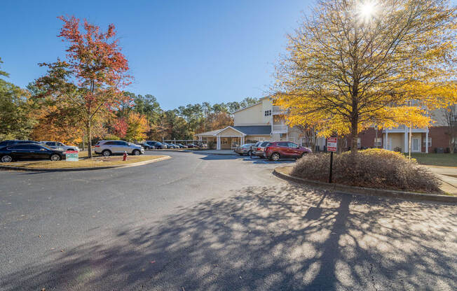 a parking lot at the whispering winds apartments in pearland, tx