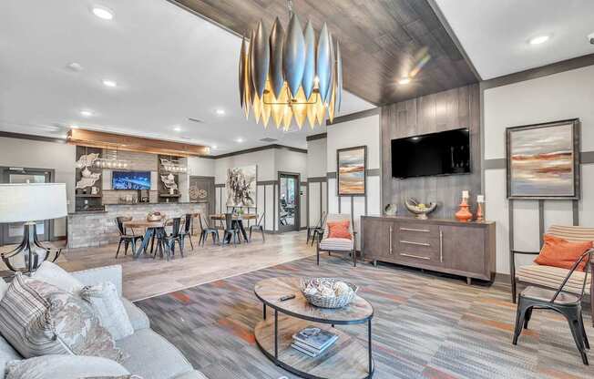 Modern living room with a grey sofa and a wooden coffee table at Sterling Creek at Richmond Hill, Richmond Hill, GA, Georgia , 31324