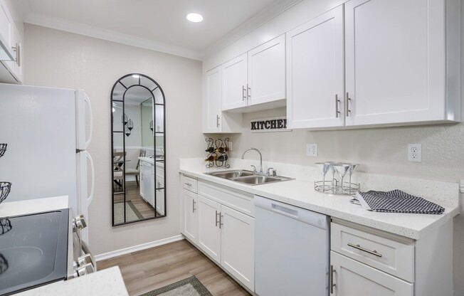 a kitchen with a sink and a microwave