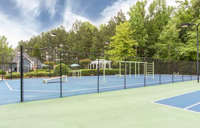 Brodick Hills tennis court with pool