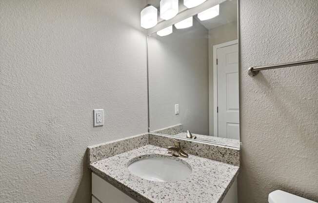 Bathroom With Granite Vanities