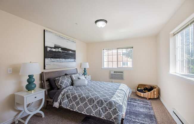 a bedroom with a bed and two windows  at Quail Springs, Washington