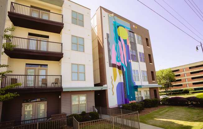 a mural on the side of an apartment building