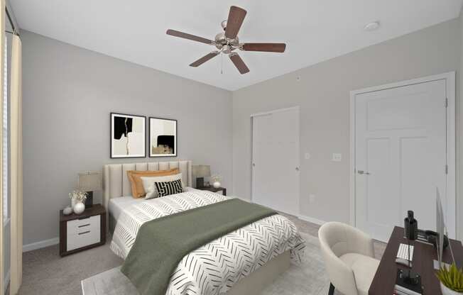 a bedroom with a large bed and a ceiling fan