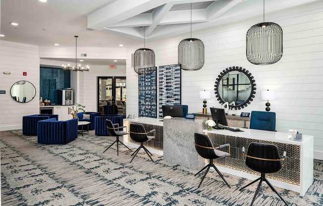 a large lobby with a reception desk and chairs