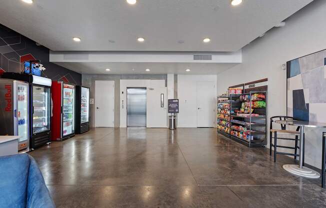 a large room with vending machines in the corner of a room