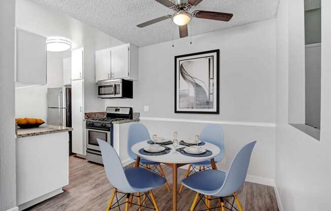 our modern kitchen and dining room with a table and chairs