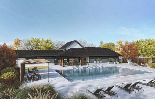 a pool with chairs and a house in the background