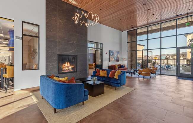 a living room filled with furniture and a fireplace