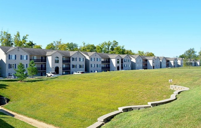 Exterior of apartment buildings and grassy field