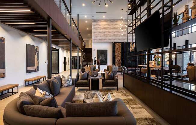 A modern living room with a brown sofa and a wooden coffee table.