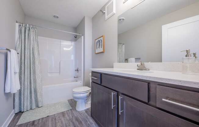 Clean and inviting bathroom with plenty of storage at White Oak