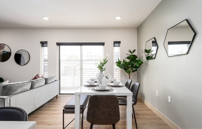 a dining room with a table and chairs