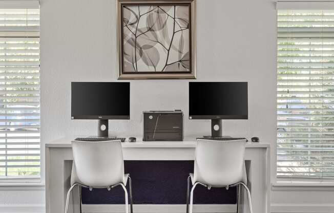 a white desk with two monitors and two chairs at Verona, Littleton, Colorado