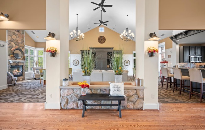 A room with a stone wall and a wooden floor.