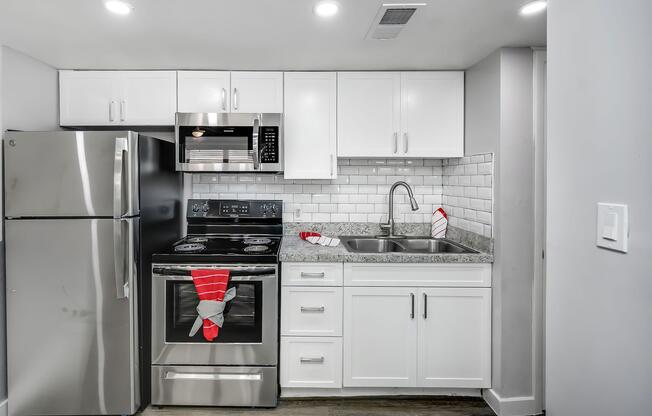 a kitchen with a stove and a refrigerator