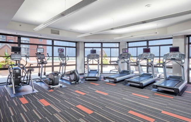 Rooftop Fitness Center With Separate Cardio and Weight Areas