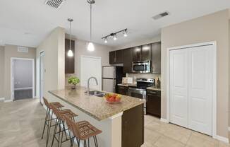 Open kitchen with upscale finishes at The Amalfi Clearwater Apartments