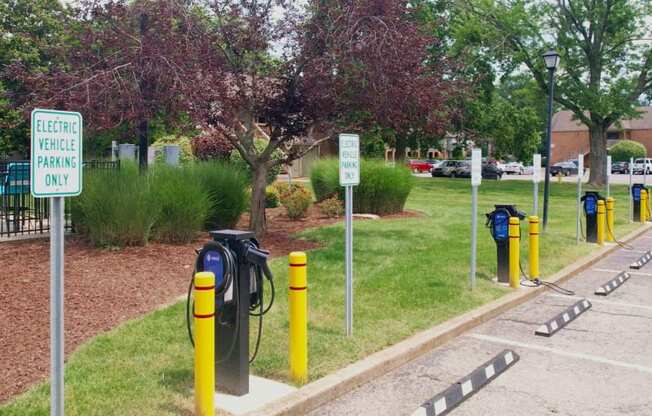 a row of electric bicycles parked in a parking lot