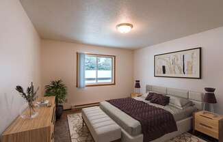 a bedroom with a bed and a window. Fargo, ND Long Island Apartments