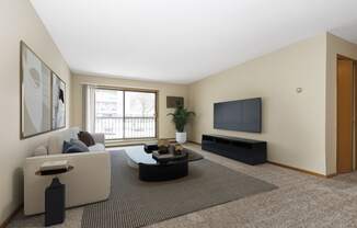 a living room with a couch and a coffee table. Anoka, MN Dellwood Estates
