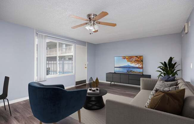 A living room with a blue chair and a grey couch.