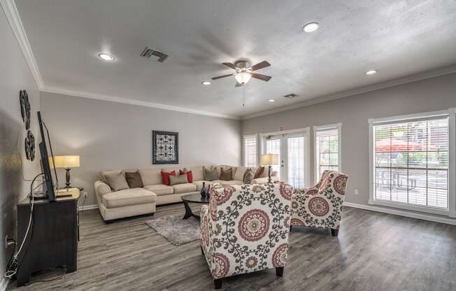 A living room with a patterned sofa and a television.