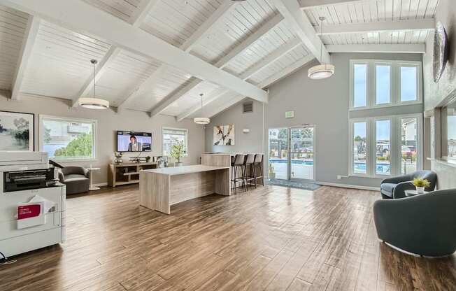 A spacious room with wooden floors and a white ceiling.