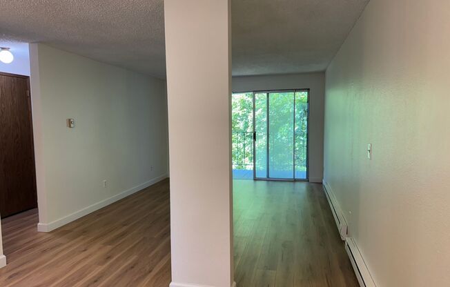Charming Condo with Creek Views, Laminate Flooring, and Prime Location Near Washington Square!
