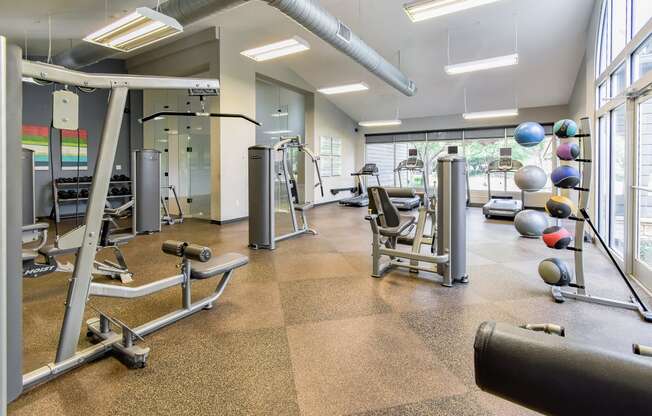 a workout room with weights and other exercise equipment  at Riverset Apartments, Tennessee, 38103