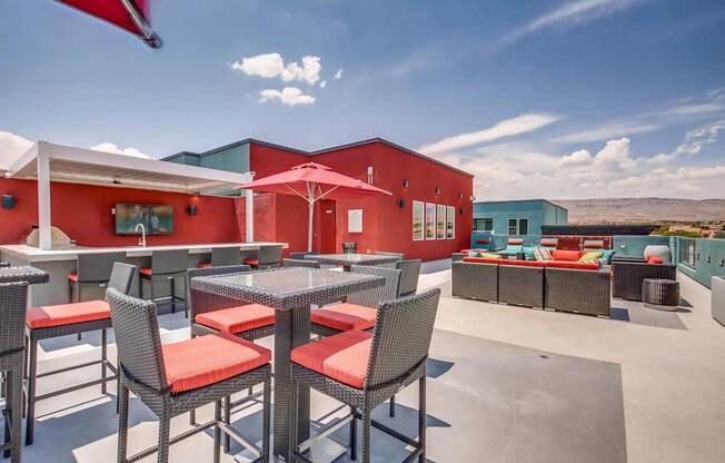 A patio with a table and chairs is set up outside.