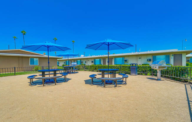 Colton, CA Apartments for Rent - Las Brisas Picnic Area with patio chairs, tables, umbrellas, and more